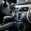 Toyota 4Runner Tackform grab handle phone mount holding a smartphone, interior view